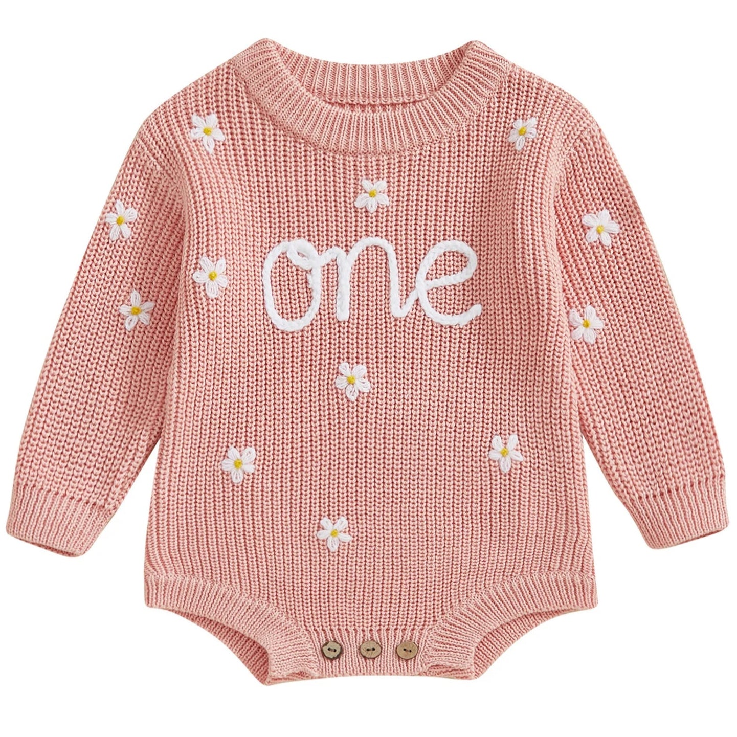 A pink knit romper for babies with 'one' written on the front and floral patterns.