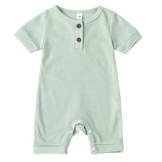 Light green baby romper with snaps for easy nappy changes – short sleeve design by pipp and lola