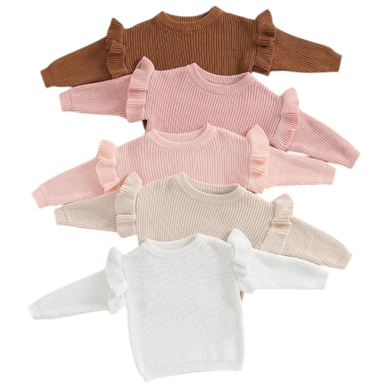 a flat lay of Chunky Knit Sweater from Pipp & Lola, in pastel colours -