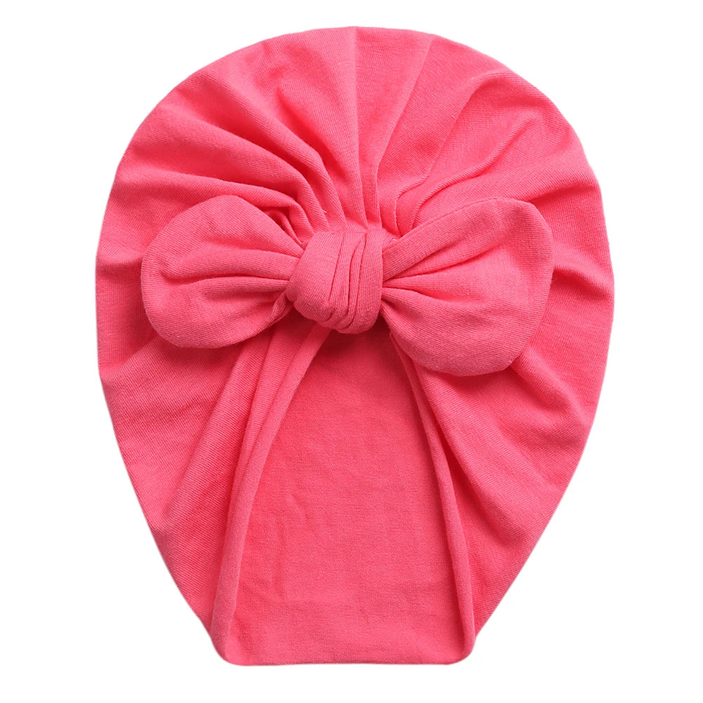 Stretchy baby turban for girls with top knot