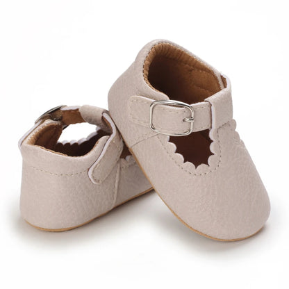 Neutral tan baby girl T-Bar sandal – soft sole comfort and protection