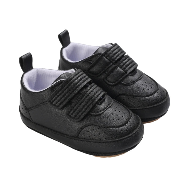 Black baby shoes with flexible sole and secure double straps – unisex by Pipp & Lola
