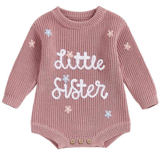 Pink knitted baby romper with 'Little Sister' embroidery