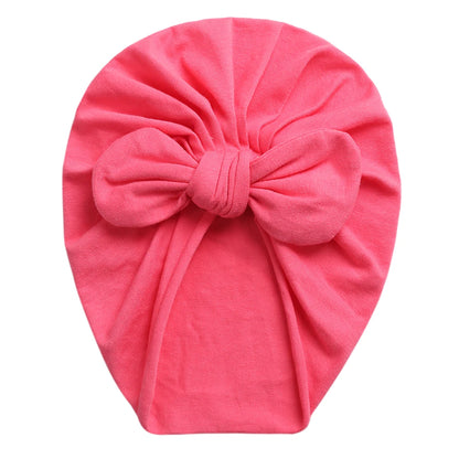 Stretchy baby turban for girls with top knot