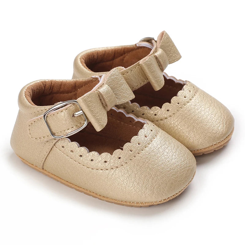 gold baby girl Mary Jane shoes with bow and Velcro strap