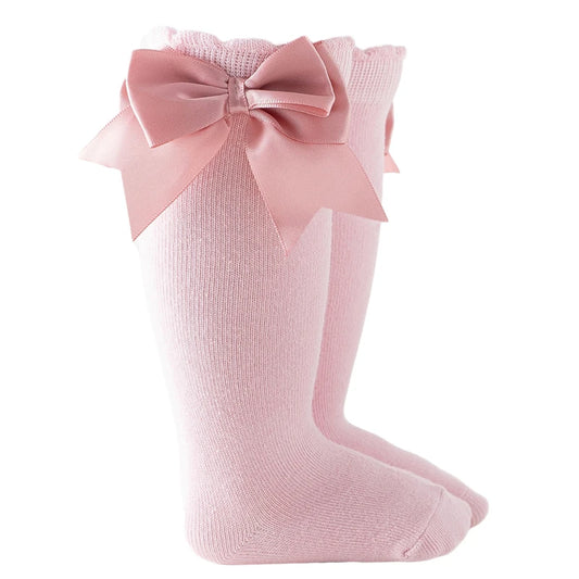 Light pink baby girl knee-high socks with silk bows