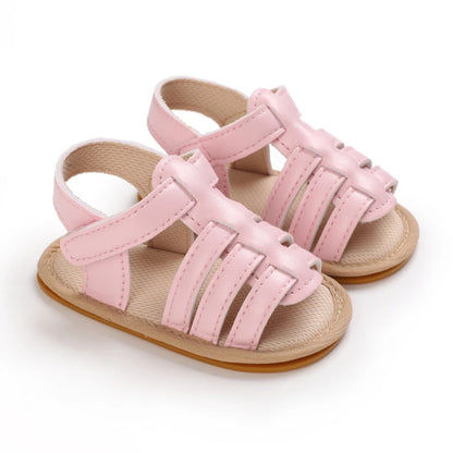 Pink Marlow baby fisherman sandals featuring classic woven-style straps, flexible soles and adjustable Velcro fastening | Pipp & Lola