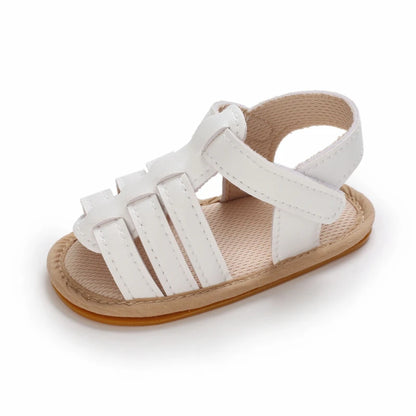 Single white Marlow baby fisherman sandal featuring a classic woven-style design, flexible sole and adjustable Velcro strap | Pipp & Lola