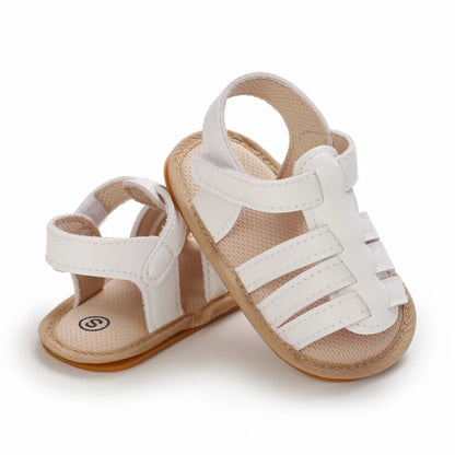 White Marlow baby fisherman sandals featuring a classic woven-style design, flexible soles and adjustable Velcro fastening | Pipp & Lola