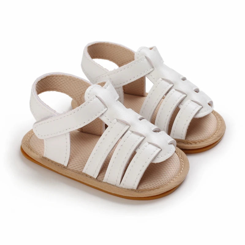 White Marlow baby fisherman sandals with woven-style straps and adjustable Velcro fastening | Pipp & Lola