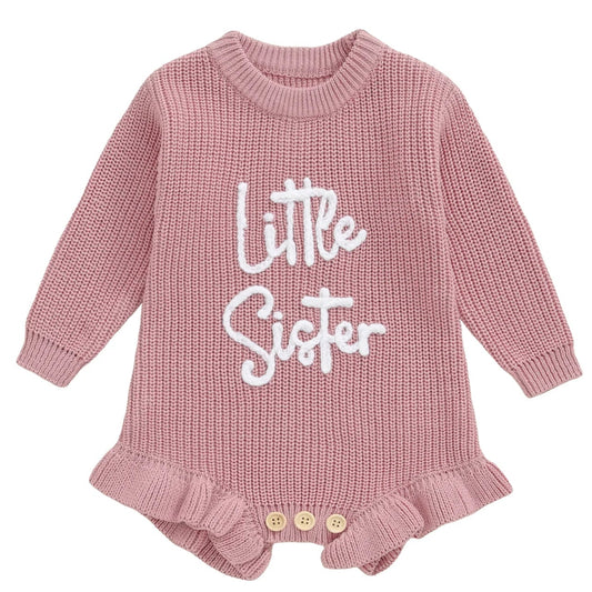 Pink knitted baby girl romper with white “Little Sister” embroidery
