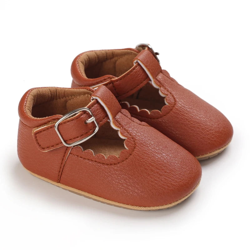Classic brown T-Bar baby girl shoe – soft sole leather-look finish