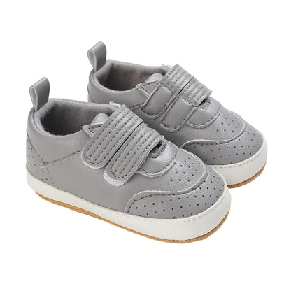 Grey baby shoes with adjustable double velcro straps – soft, flexible sole for boys and girls by Pipp & Lola